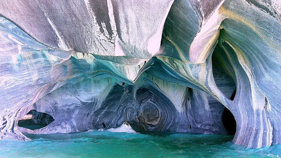 The sculpted blue Marble Caves rising from Lago General Carrera near Puerto Rio Tranquilo